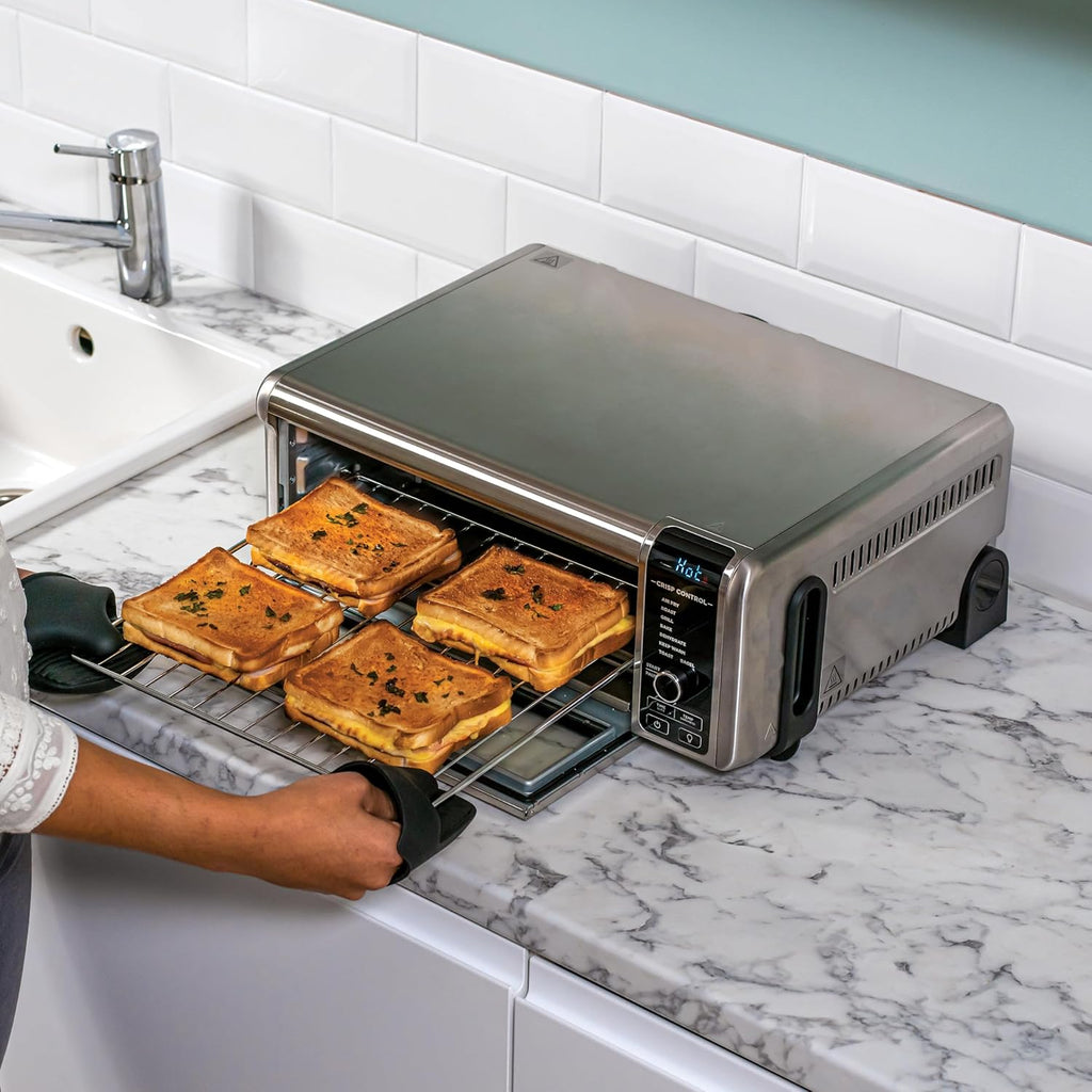 Ninja Foodi Four Multifonctions 8-en-1, Mini four portable, surfaces de travail, four multifonctions avec 8 fonctions de cuisson ; Air Fry, Rôtir, Griller, Cuire et plus encore. Argent/Noir SP101EU